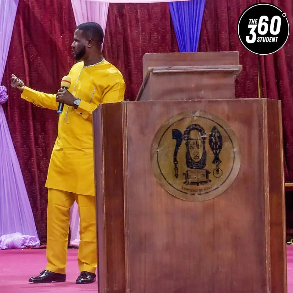 A facilitator speaking from the lectern at the 360 Degree Student Conference.