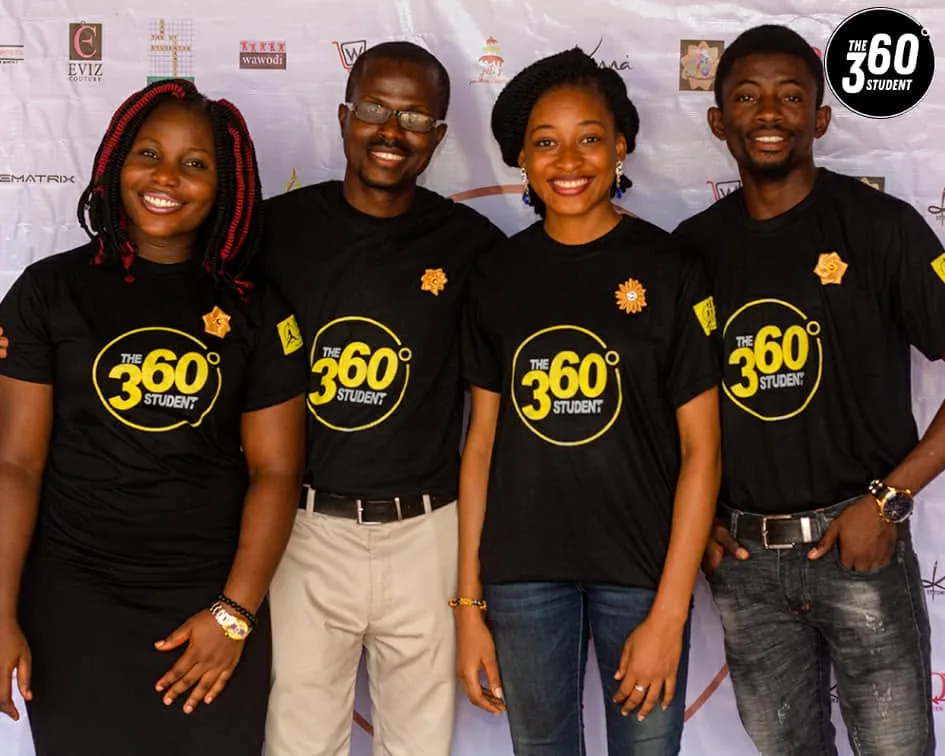 Four volunteers in branded 360 shirts at the conference.