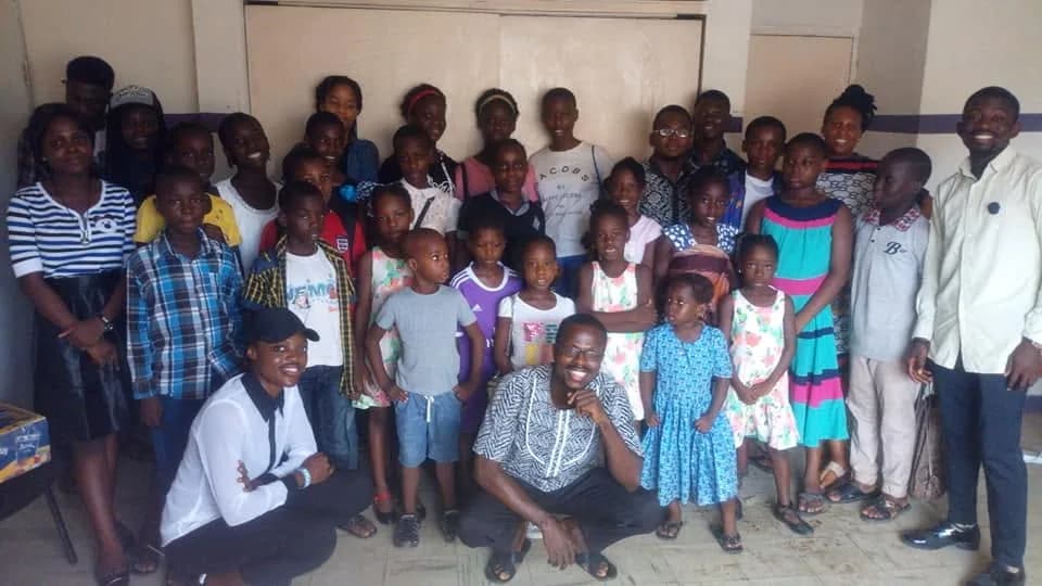 A teens club session with participants gathered for a group photograph.