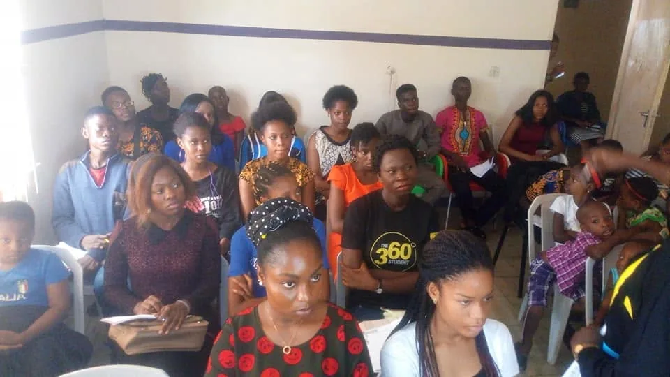 A well-attended teens session with participants seated throughout the room.