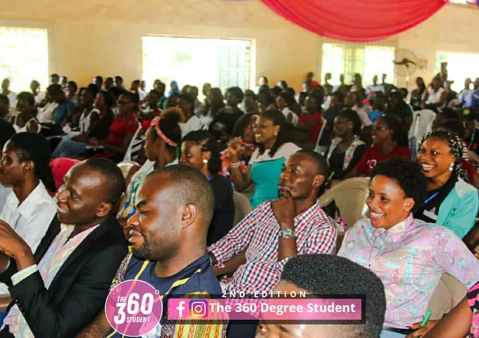 Young professionals seated among the audience at the 360 Degree Student Conference.